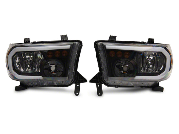 Raxiom 07-13 Toyota Tundra Axial Series Headlights w/ LED Bar- Black Housing (Clear Lens)