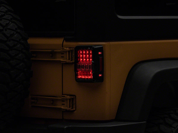 Raxiom 07-18 Jeep Wrangler JK Axial Series Lux LED Tail Lights- Black Housing (Clear Lens)