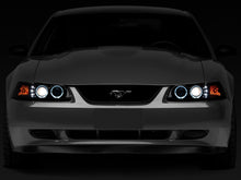 Load image into Gallery viewer, Raxiom 99-04 Ford Mustang Dual LED Halo Projector Headlights- Black Housing (Smoked Lens)