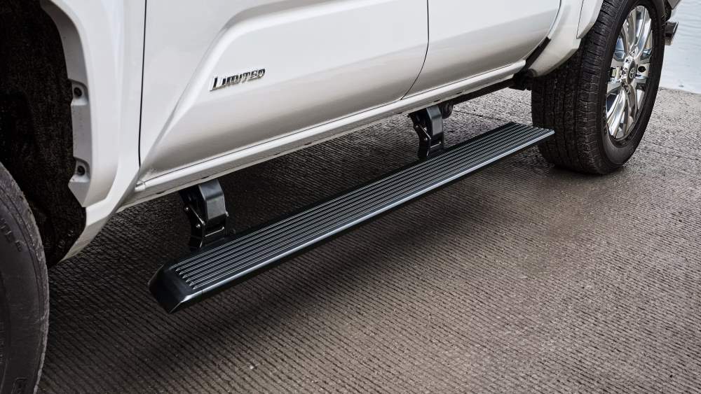  Close-up of a Toyota Tacoma Limited edition showcasing a sleek, retractable running board, providing easy access and a stylish upgrade.